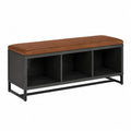 Banc en métal noir avec coussin en cuir synthétique brun et rangement